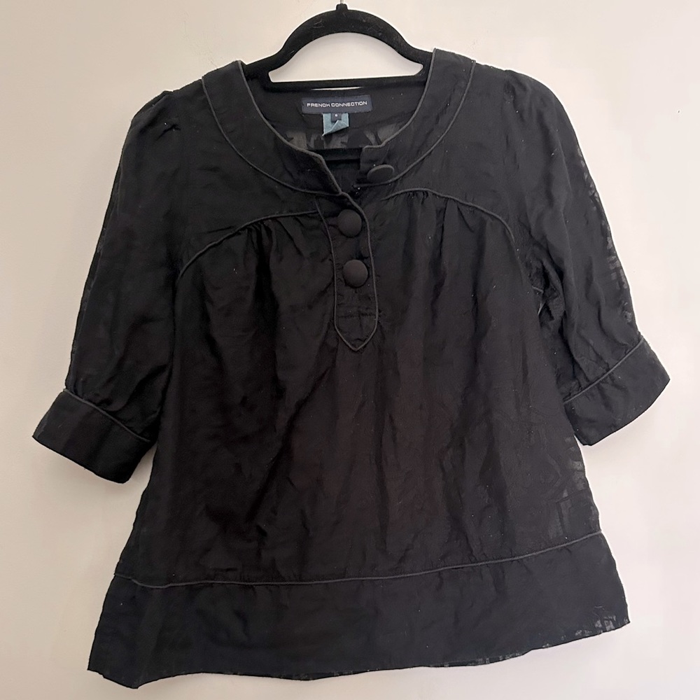 French Connection blouse. Sheer with floral print. Large buttons.